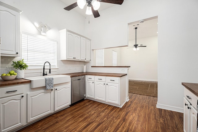 3515 Winnie St, Galveston, TX 77550 - kitchen featuring ceiling fan, dishwasher, wooden counters, a peninsula, and high vaulted ceiling