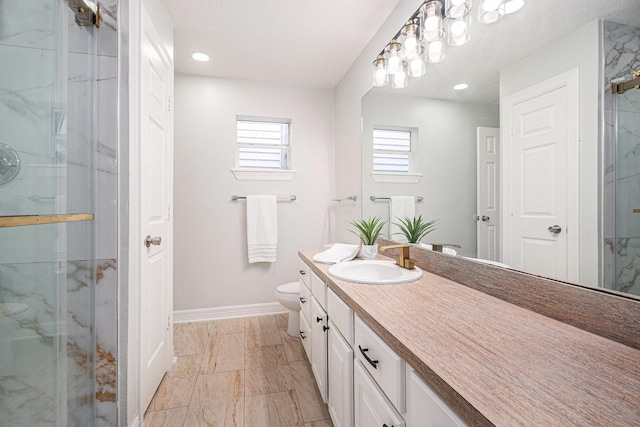 3515 Winnie St, Galveston, TX 77550 - full bath featuring marble finish floors, vanity, a marble finish shower, and recessed lighting
