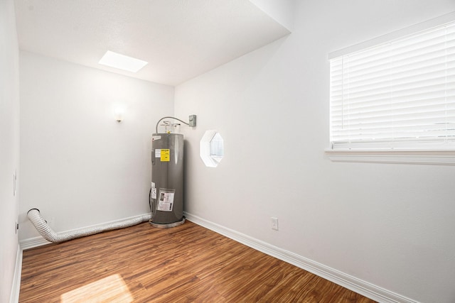 3515 Winnie St, Galveston, TX 77550 - utility room featuring electric water heater