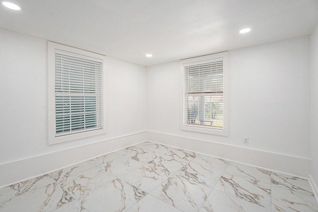 3515 Winnie St, Galveston, TX 77550 - unfurnished room with marble look tiles and recessed lighting