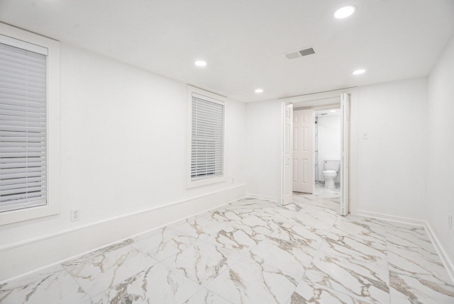 3515 Winnie St, Galveston, TX 77550 - spare room featuring recessed lighting and light marble finish floors