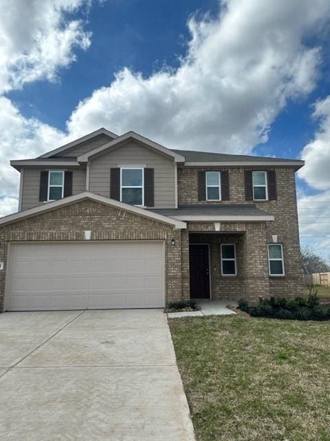 5031 Gazelle Leap Ln, Richmond, TX 77406 - view of front facade with brick siding, concrete driveway, a front yard, and an attached garage