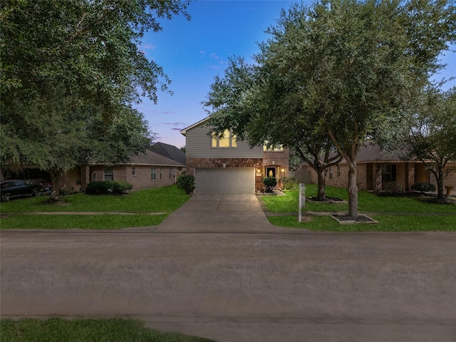 20523 Ranch Mill Ln, Cypress, TX 77433 - view of front of home with driveway, a garage, and a front lawn