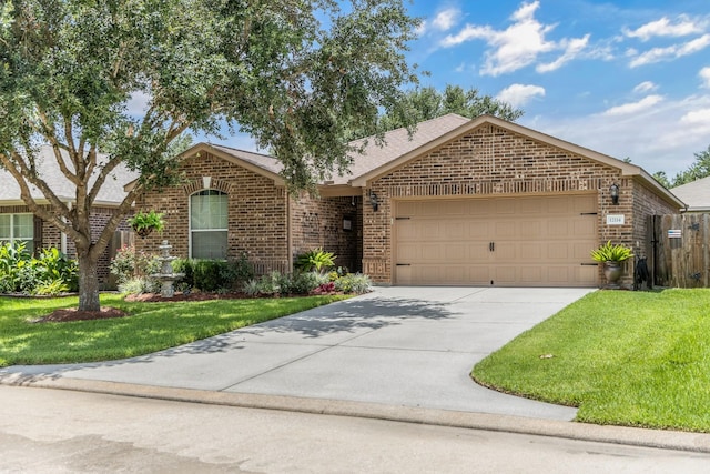 12114 Mabel Ln, Pinehurst, TX 77362 - ranch-style home with brick siding, an attached garage, driveway, and roof with shingles