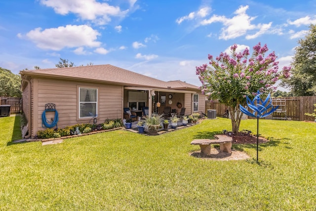 12114 Mabel Ln, Pinehurst, TX 77362 - back of house featuring a patio area and roof with shingles