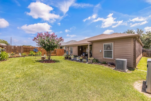 12114 Mabel Ln, Pinehurst, TX 77362 - rear view of property with a fenced backyard and a patio