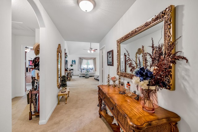 12114 Mabel Ln, Pinehurst, TX 77362 - corridor featuring light colored carpet and arched walkways