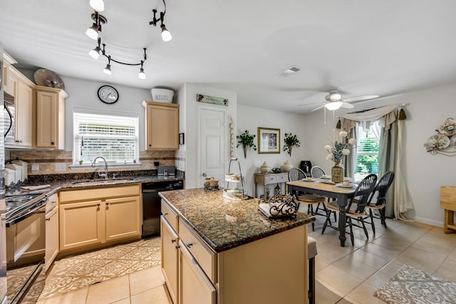12114 Mabel Ln, Pinehurst, TX 77362 - kitchen featuring black appliances, healthy amount of natural light, tasteful backsplash, and light tile patterned floors