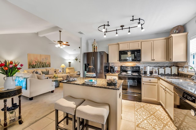 12114 Mabel Ln, Pinehurst, TX 77362 - kitchen featuring black appliances, light tile patterned flooring, a center island, dark stone countertops, and tasteful backsplash