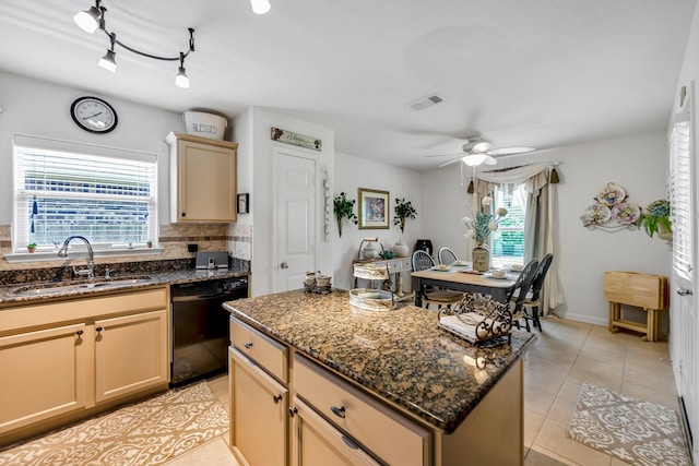 12114 Mabel Ln, Pinehurst, TX 77362 - kitchen with black dishwasher, a center island, a ceiling fan, light tile patterned floors, and dark stone countertops