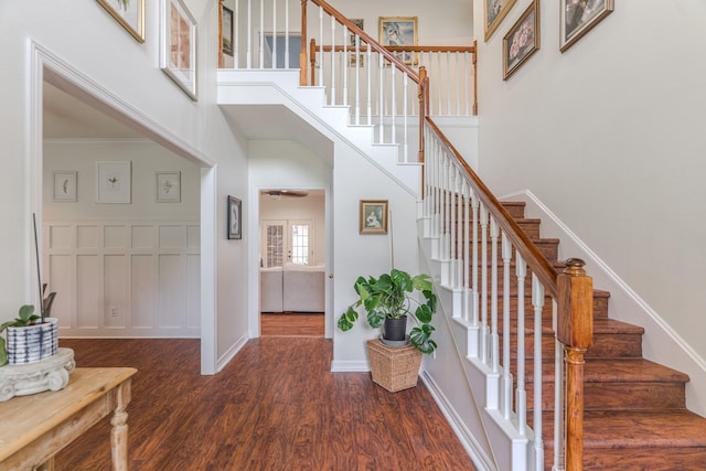 18988 Ocean Mist Ct, Montgomery, TX 77356 - staircase featuring a towering ceiling, wood finished floors, and ceiling fan