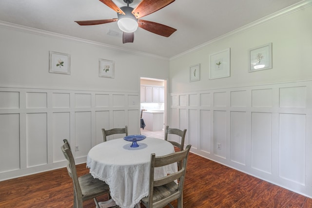 18988 Ocean Mist Ct, Montgomery, TX 77356 - dining area featuring a decorative wall, crown molding, dark wood-style floors, and a ceiling fan