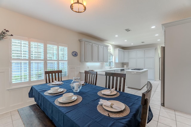 18988 Ocean Mist Ct, Montgomery, TX 77356 - dining room with a decorative wall, light tile patterned flooring, healthy amount of natural light, wainscoting, and recessed lighting
