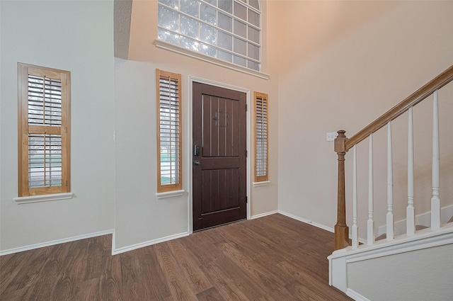 23035 Canal Rd, Richmond, TX 77406 - entryway with wood finished floors, stairs, and a high ceiling