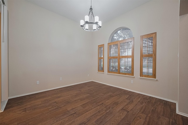 23035 Canal Rd, Richmond, TX 77406 - unfurnished room featuring a chandelier and dark wood-style floors