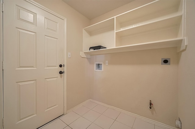 23035 Canal Rd, Richmond, TX 77406 - washroom featuring hookup for a washing machine, hookup for an electric dryer, and light tile patterned floors