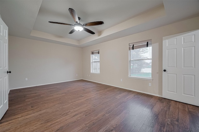 23035 Canal Rd, Richmond, TX 77406 - spare room with a tray ceiling, wood finished floors, and a ceiling fan
