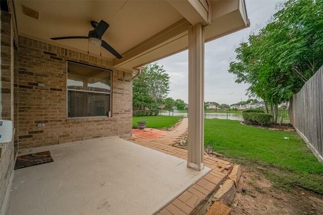 23035 Canal Rd, Richmond, TX 77406 - view of patio / terrace with a ceiling fan and a water view