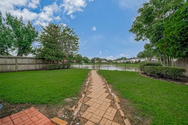 23035 Canal Rd, Richmond, TX 77406 - fenced backyard featuring a water view
