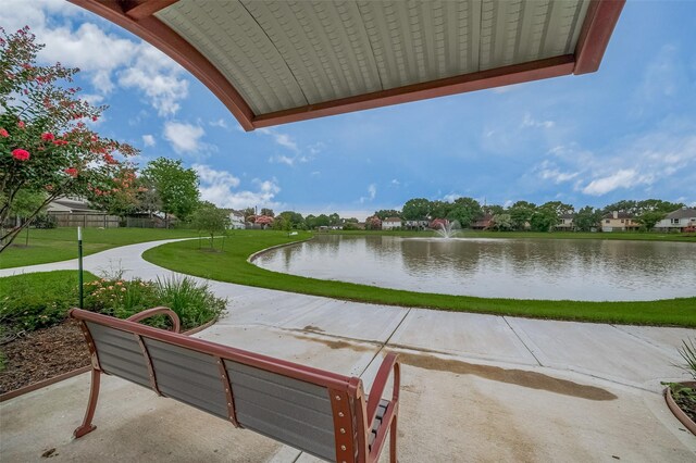 23035 Canal Rd, Richmond, TX 77406 - view of community featuring a water view and a lawn