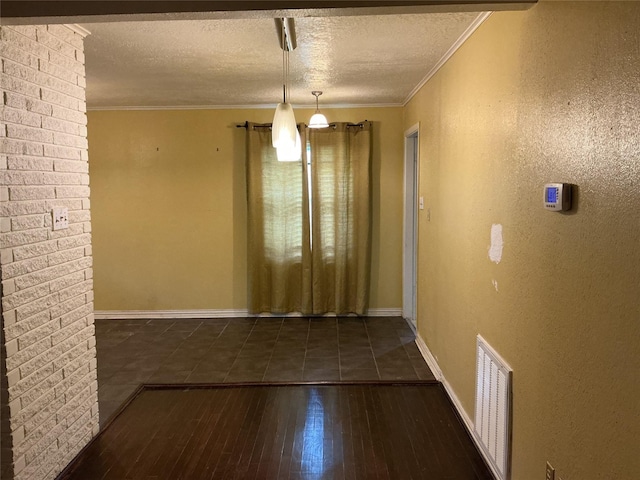416 Fenn St, Houston, TX 77018 - unfurnished dining area with hardwood / wood-style flooring, a textured ceiling, and crown molding