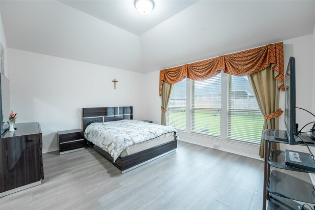 2627 Rosepoint Ct, Fresno, TX 77545 - bedroom featuring light wood-style floors and vaulted ceiling