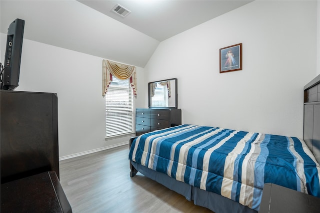 2627 Rosepoint Ct, Fresno, TX 77545 - bedroom with wood finished floors and vaulted ceiling