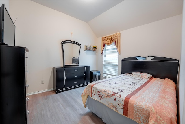 2627 Rosepoint Ct, Fresno, TX 77545 - bedroom featuring light wood-type flooring and vaulted ceiling