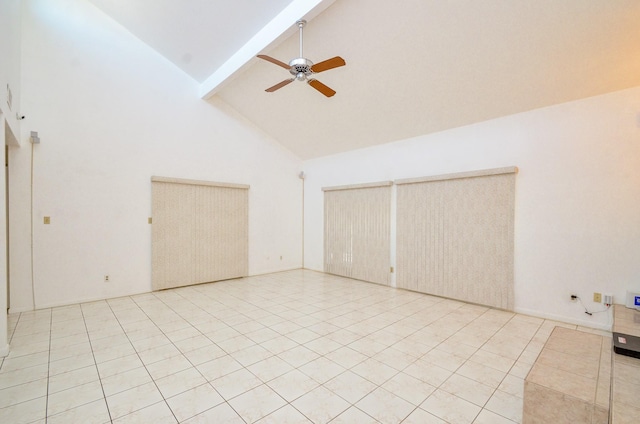 10723 Bexley Dr, Houston, TX 77099 - empty room with high vaulted ceiling, beamed ceiling, ceiling fan, and light tile patterned floors