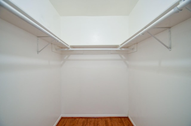 10723 Bexley Dr, Houston, TX 77099 - walk in closet featuring wood finished floors