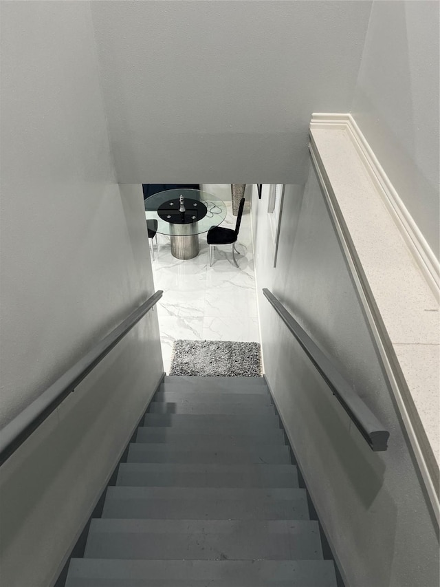 3140 Webster St, Houston, TX 77004 - stairway featuring marble finish flooring