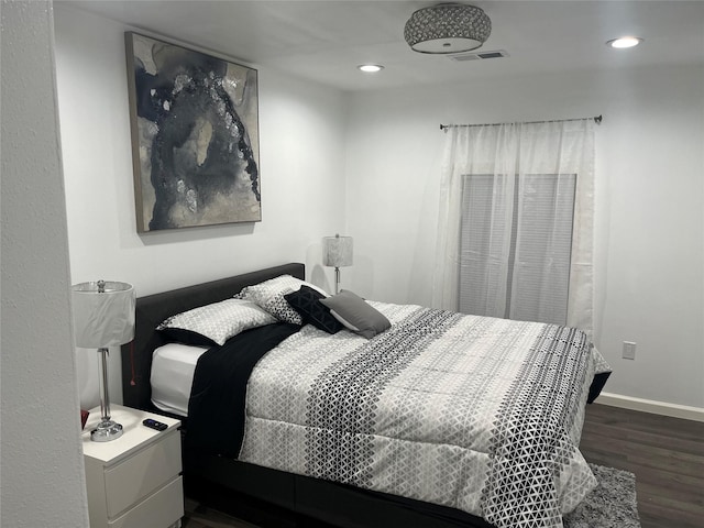 3140 Webster St, Houston, TX 77004 - bedroom with dark wood-style floors and recessed lighting