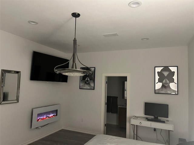 3140 Webster St, Houston, TX 77004 - living room with dark wood-style flooring and recessed lighting