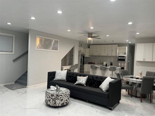 3140 Webster St, Houston, TX 77004 - living area with light marble finish flooring, recessed lighting, stairs, and a ceiling fan