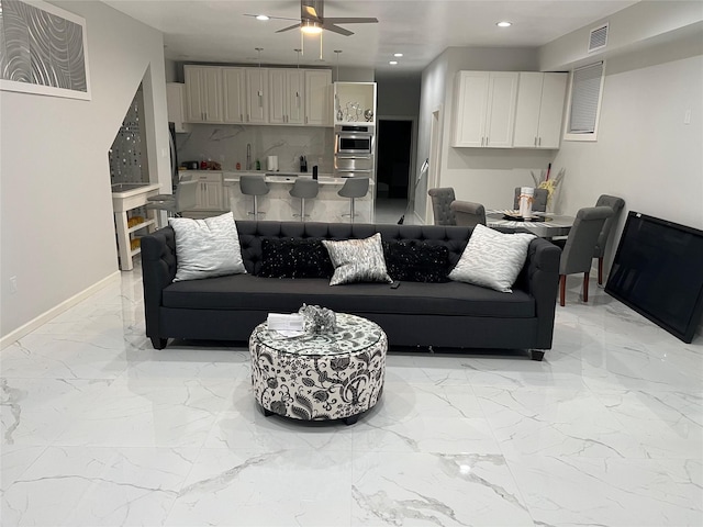 3140 Webster St, Houston, TX 77004 - living area featuring a ceiling fan, light marble finish flooring, and recessed lighting