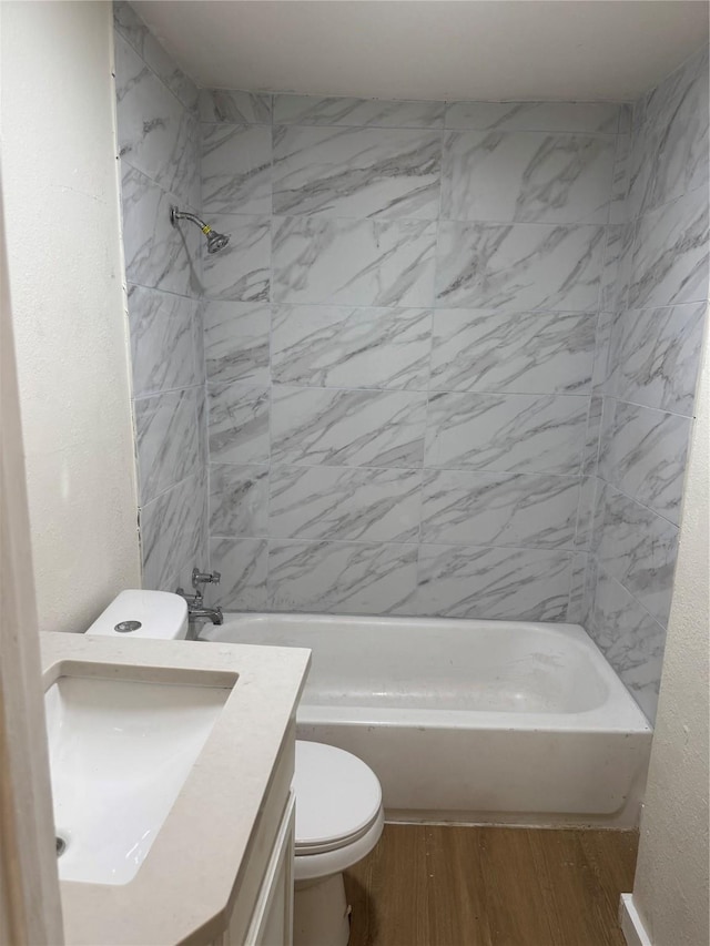 412 Owens St, Houston, TX 77029 - full bath featuring vanity, wood finished floors, and washtub / shower combination