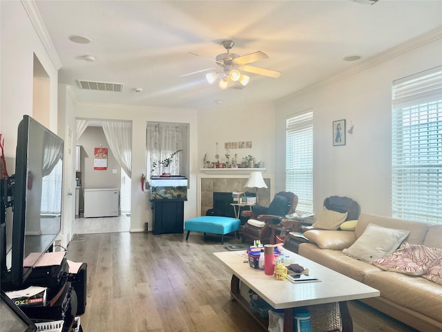 8118 Barnes Ridge Ln, Houston, TX 77072 - living area with plenty of natural light, wood finished floors, ceiling fan, and ornamental molding