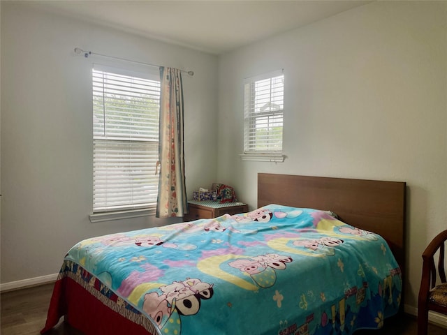 8118 Barnes Ridge Ln, Houston, TX 77072 - bedroom featuring wood finished floors and baseboards