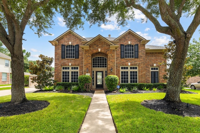 2006 Scarlet Trail Ct, Katy, TX 77494 - traditional-style house with a front lawn and brick siding