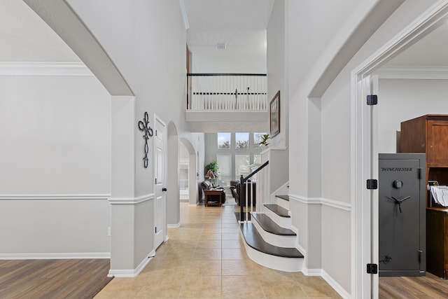 2006 Scarlet Trail Ct, Katy, TX 77494 - foyer with stairway, arched walkways, crown molding, and light tile patterned flooring
