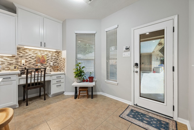 2006 Scarlet Trail Ct, Katy, TX 77494 - doorway to outside with light tile patterned flooring and built in desk