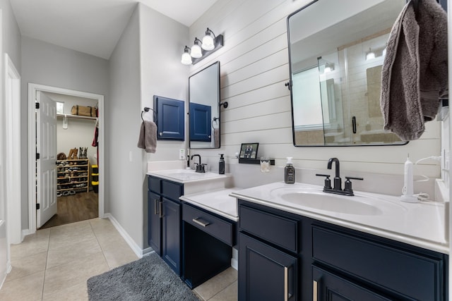 2006 Scarlet Trail Ct, Katy, TX 77494 - full bathroom with double vanity, a stall shower, tile patterned floors, and a walk in closet