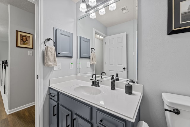 2006 Scarlet Trail Ct, Katy, TX 77494 - bathroom with wood finished floors and vanity