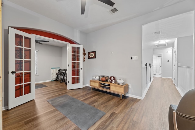 2006 Scarlet Trail Ct, Katy, TX 77494 - entrance foyer featuring french doors, a ceiling fan, wood finished floors, and arched walkways