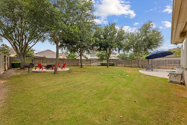 2006 Scarlet Trail Ct, Katy, TX 77494 - fenced backyard with a patio area and an outdoor fire pit