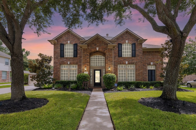 2006 Scarlet Trail Ct, Katy, TX 77494 - traditional home featuring a yard and brick siding