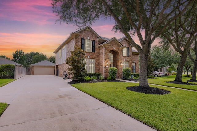 2006 Scarlet Trail Ct, Katy, TX 77494 - traditional home featuring brick siding, a front lawn, a garage, and driveway