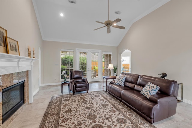 12715 Havant Cir, Houston, TX 77077 - living room featuring a high end fireplace, a ceiling fan, high vaulted ceiling, arched walkways, and crown molding