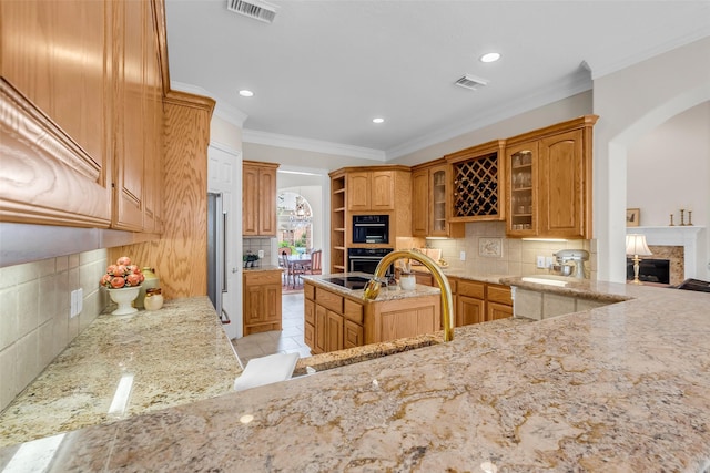 12715 Havant Cir, Houston, TX 77077 - kitchen with a premium fireplace, backsplash, light stone counters, open shelves, and oven