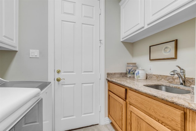 12715 Havant Cir, Houston, TX 77077 - laundry area featuring cabinet space and washer and dryer